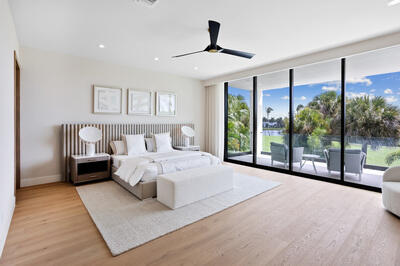 17119 Whitehaven Drive Boca Raton, FL 33496 - Photo 10 of 15 a bedroom with a large bed and a large window