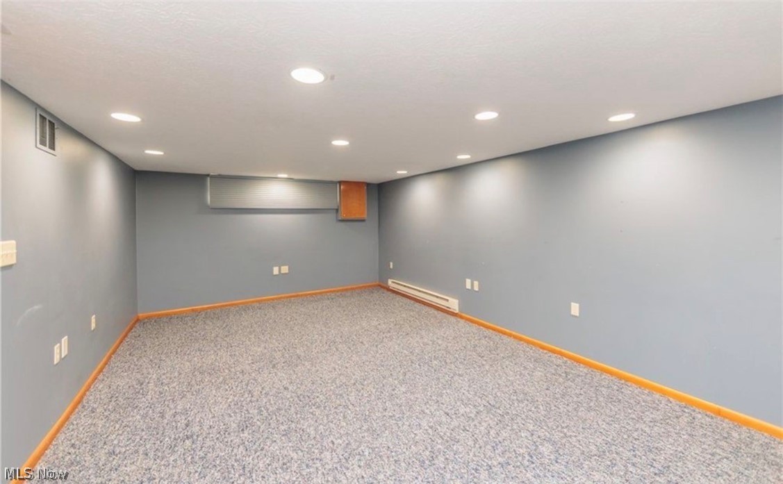 4521 Emerson Road South Euclid, OH 44121 - Photo 36 of 47 Spacious room featuring neutral blue-gray walls, recessed lighting, wall-to-wall carpeting, and wood-finish baseboards
