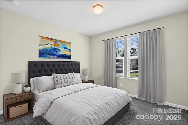 a bedroom with bed and window