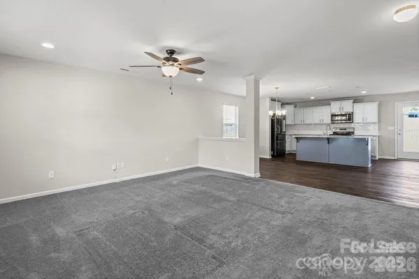 a view of a kitchen with a sink and a stove top oven