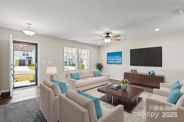 a living room with furniture and a flat screen tv