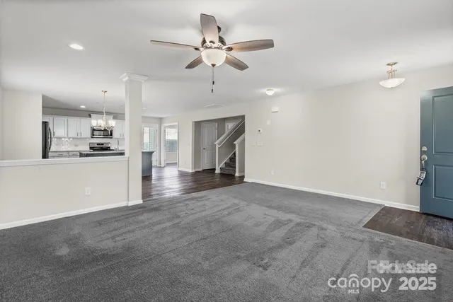 a view of a kitchen with a sink and a stove top oven