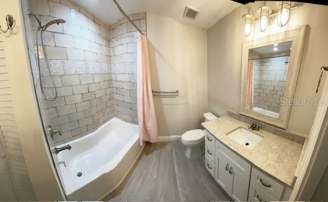 628 Boca Ciega Point Boulevard South St. Petersburg, FL 33708 - Photo 13 of 17 a bathroom with a sink a toilet and shower