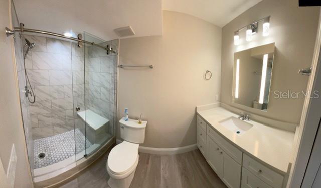 628 Boca Ciega Point Boulevard South St. Petersburg, FL 33708 - Photo 10 of 17 a bathroom with a granite countertop sink toilet and shower