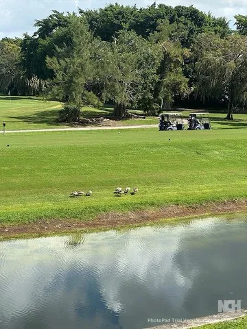 a view of a golf course with a lake