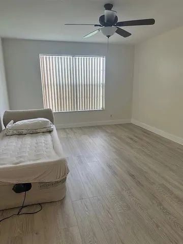 an entryway with wooden floor