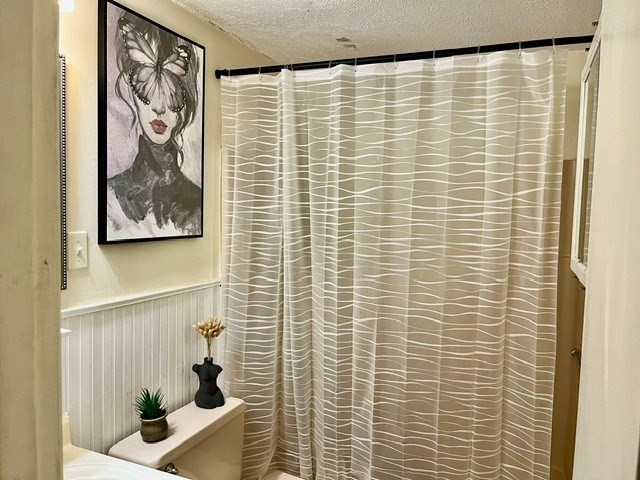 41 Leonard Road, Unit 41 Boxborough, MA 01719 - Photo 6 of 7 a bathroom with a shower curtain
