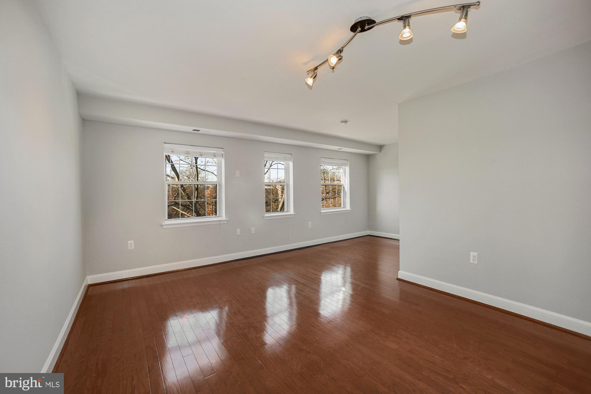 3611 38th Street Northwest, Unit 403 Washington, DC 20016 - Photo 19 of 20 Enter an open floor plan with lots of light