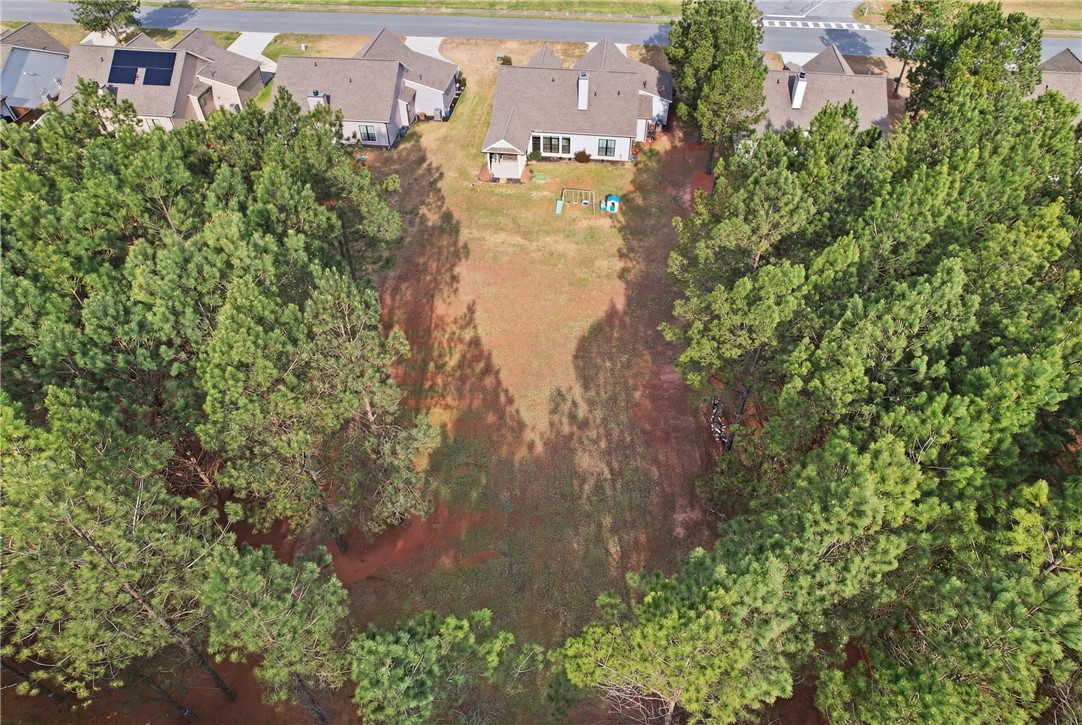 127 West Stewart Street Pelzer, SC 29669 - Photo 21 of 23 This aerial view showcases a residence nestled amidst natural surroundings, offering ample outdoor space.
