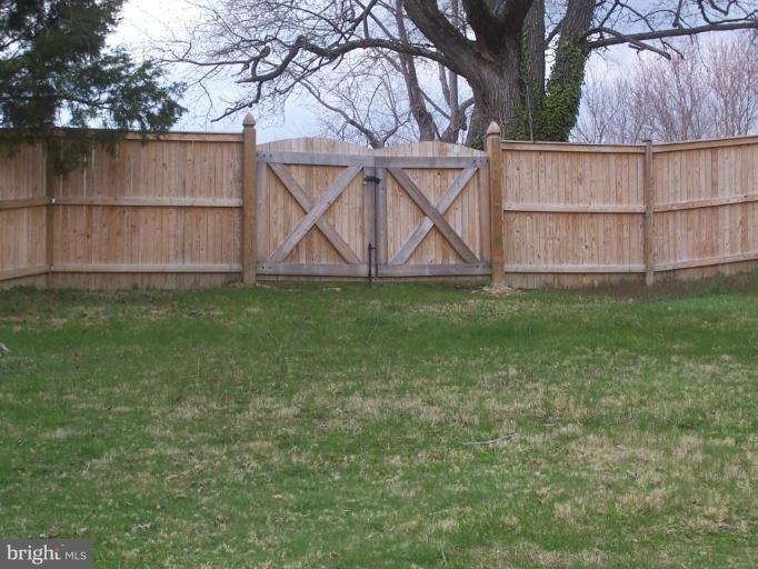 4412 Henderson Road Temple Hills, MD 20748 - Photo 12 of 13 a backyard of a house with lots of green space