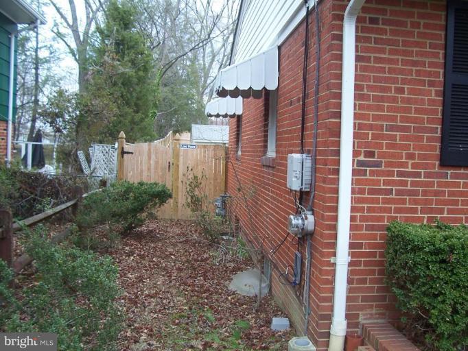 4412 Henderson Road Temple Hills, MD 20748 - Photo 13 of 13 a backyard of a house with lots of green space