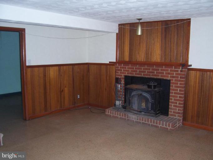 4412 Henderson Road Temple Hills, MD 20748 - Photo 3 of 13 a view of a livingroom with a fireplace
