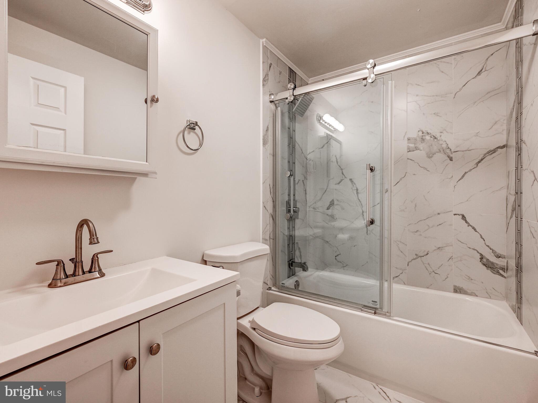 8127 Del Haven Road Dundalk, MD 21222 - Photo 11 of 25 a bathroom with a sink toilet and shower