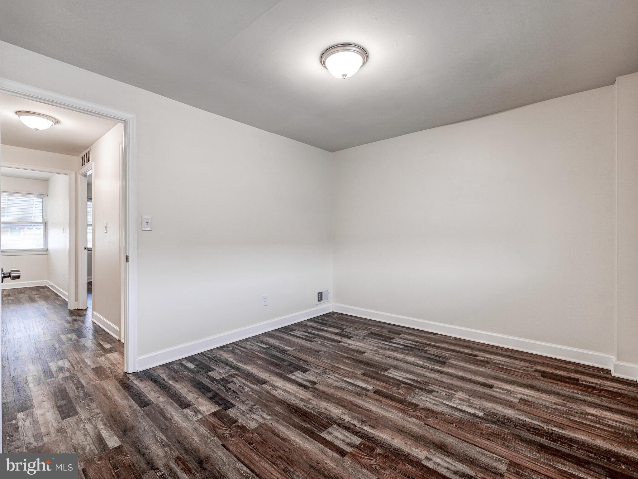 8127 Del Haven Road Dundalk, MD 21222 - Photo 16 of 25 wooden floor in an empty room