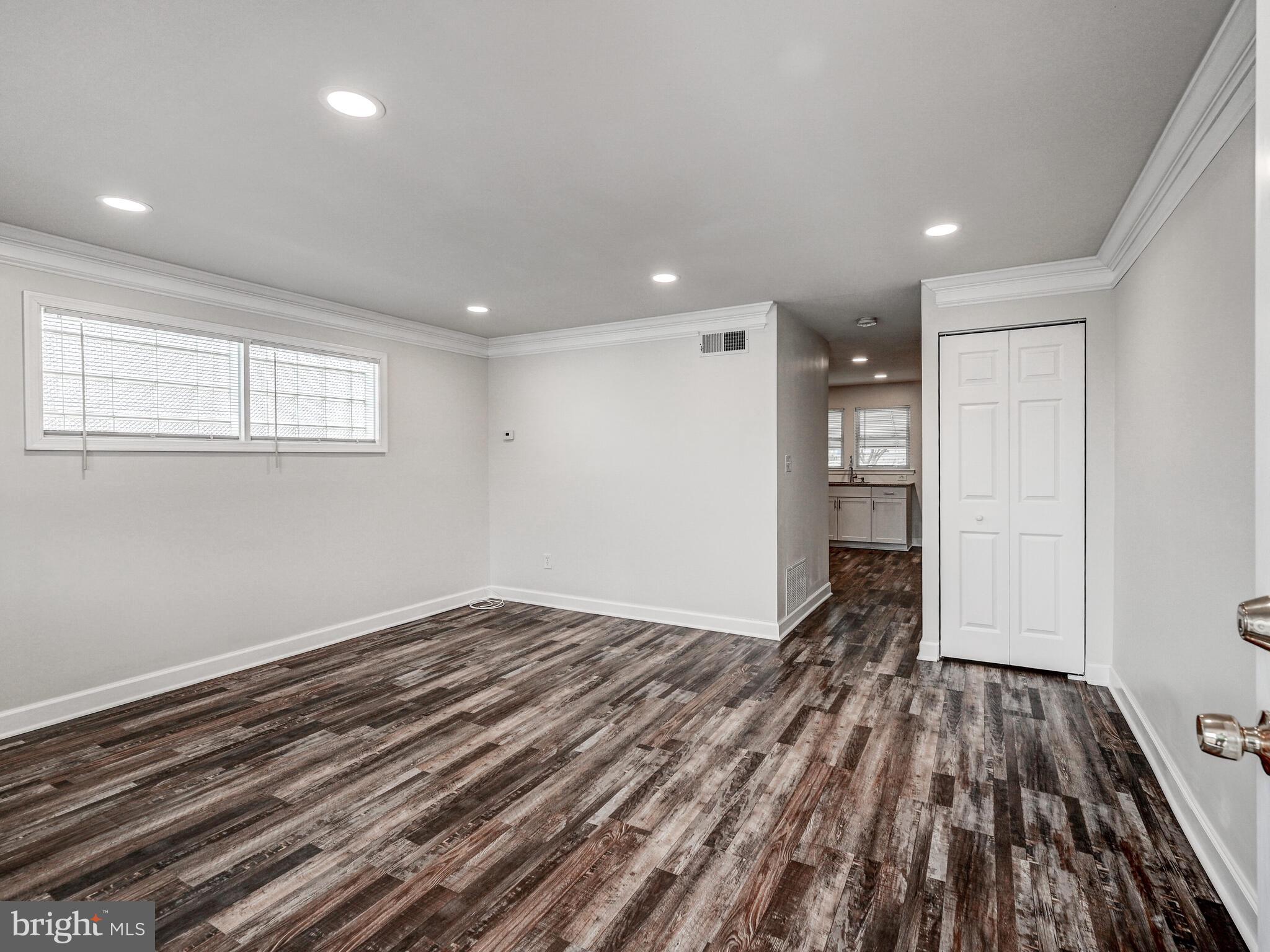 8127 Del Haven Road Dundalk, MD 21222 - Photo 3 of 25 a view of wooden floor in an empty room
