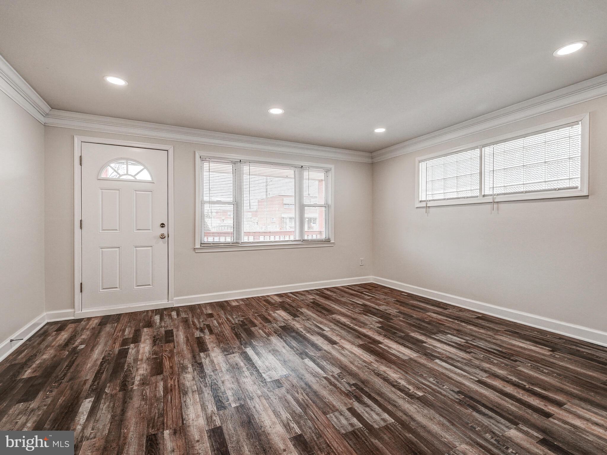8127 Del Haven Road Dundalk, MD 21222 - Photo 4 of 25 a view of empty room with wooden floor