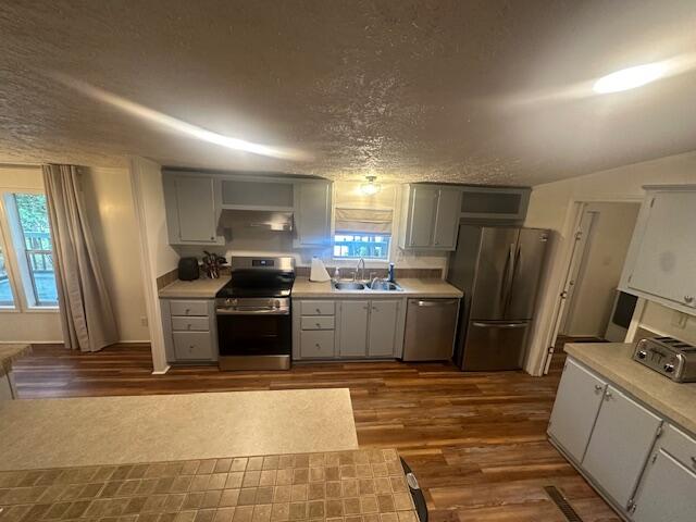 763 Squirrel Road DeFuniak Springs, FL 32433 - Photo 20 of 28 a kitchen with a refrigerator sink and wooden cabinets