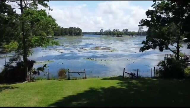 763 Squirrel Road DeFuniak Springs, FL 32433 - Photo 2 of 28 a view of a lake from a yard