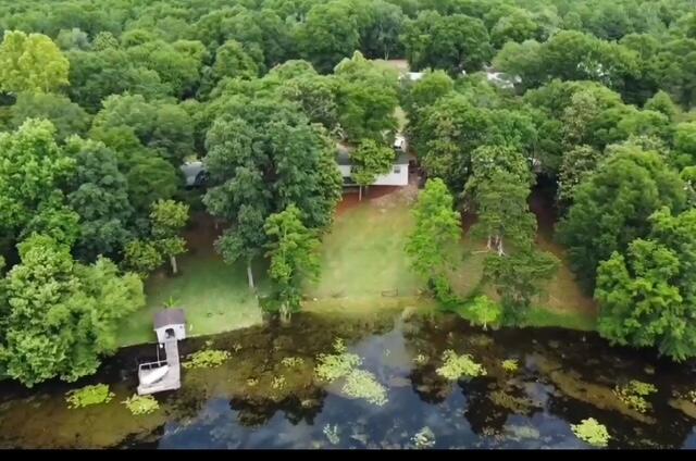 763 Squirrel Road DeFuniak Springs, FL 32433 - Photo 28 of 28 a view of a lake with large trees