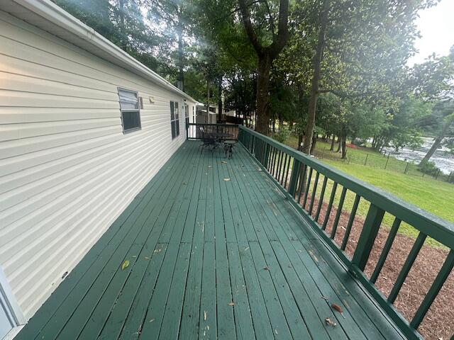 763 Squirrel Road DeFuniak Springs, FL 32433 - Photo 5 of 28 a view of a balcony with wooden floor