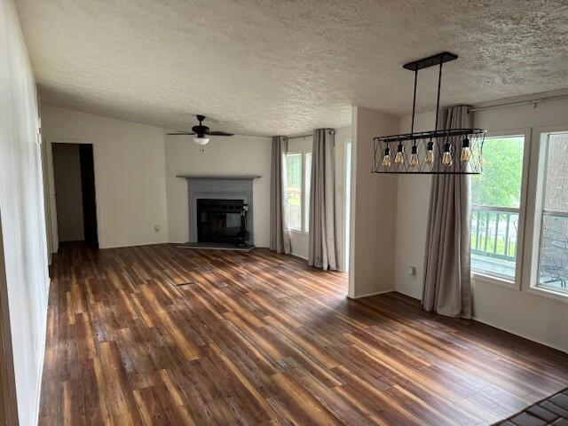 763 Squirrel Road DeFuniak Springs, FL 32433 - Photo 8 of 28 a view of empty room with wooden floor fireplace and windows