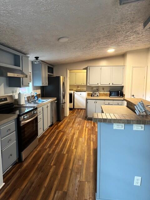 763 Squirrel Road DeFuniak Springs, FL 32433 - Photo 9 of 28 a kitchen with stainless steel appliances kitchen island granite countertop a sink dishwasher stove top oven and cabinets with wooden floor