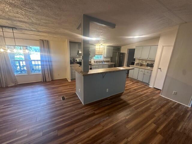 763 Squirrel Road DeFuniak Springs, FL 32433 - Photo 10 of 28 a kitchen with stainless steel appliances granite countertop a refrigerator and a stove top oven