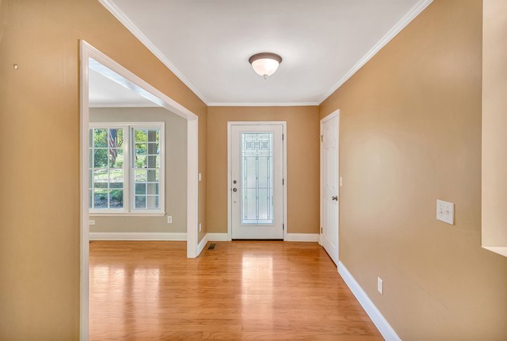 106 Pikes Ridge Anderson, SC 29626 - Photo 11 of 41 Gleaming hardwood floors and classic crown molding welcome guests into this elegant entryway.