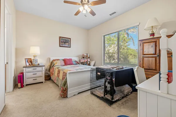 a bedroom with a bed and a table