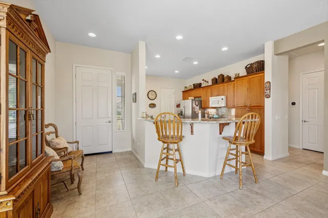 a dining room filled a chandelier and a dining table