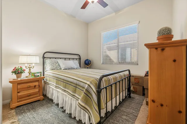 a bedroom with a bed and a window