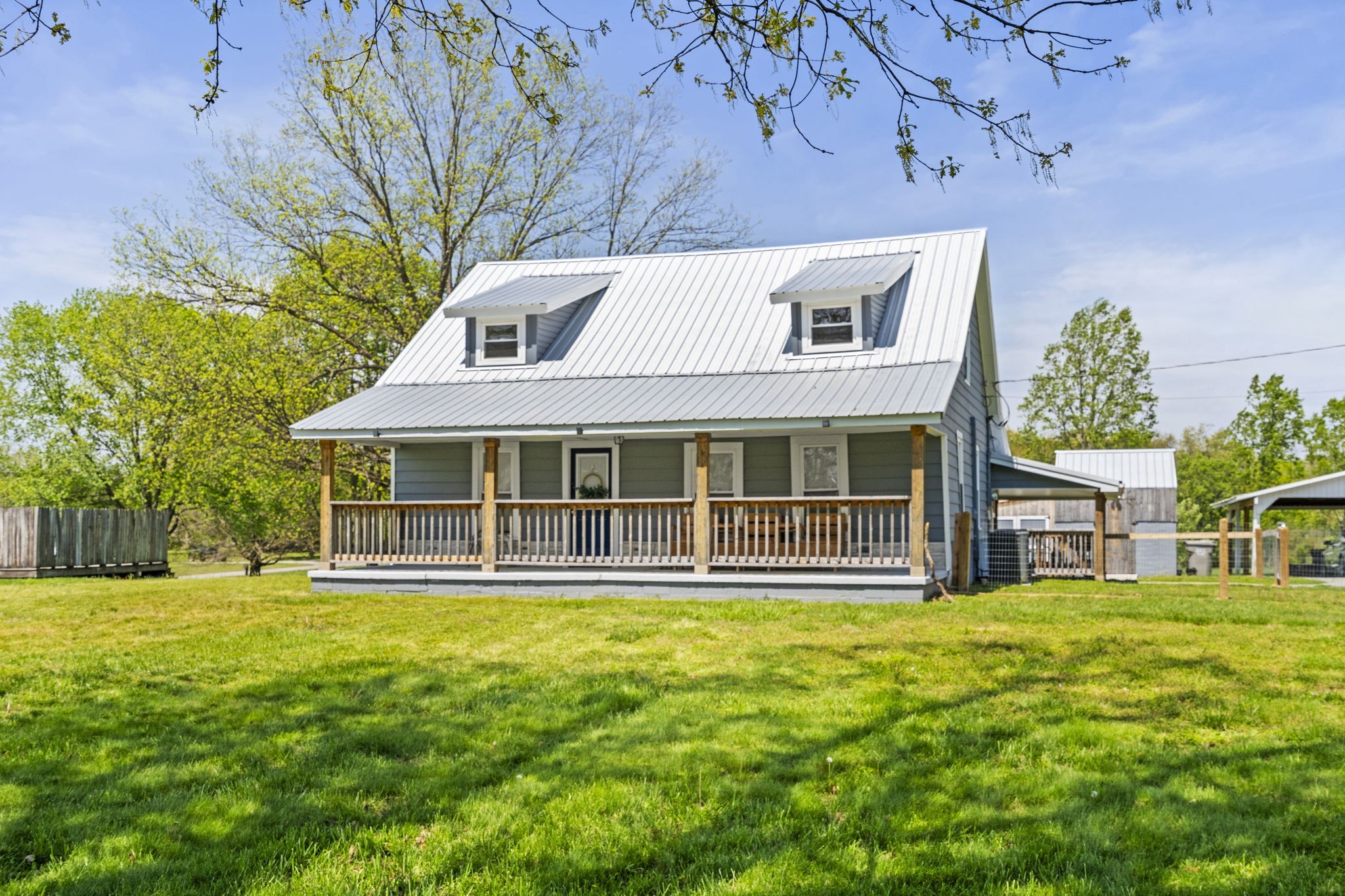 2470 Hinton Road Clarksville, TN 37043 - Photo 1 of 34 a front view of a house with a garden