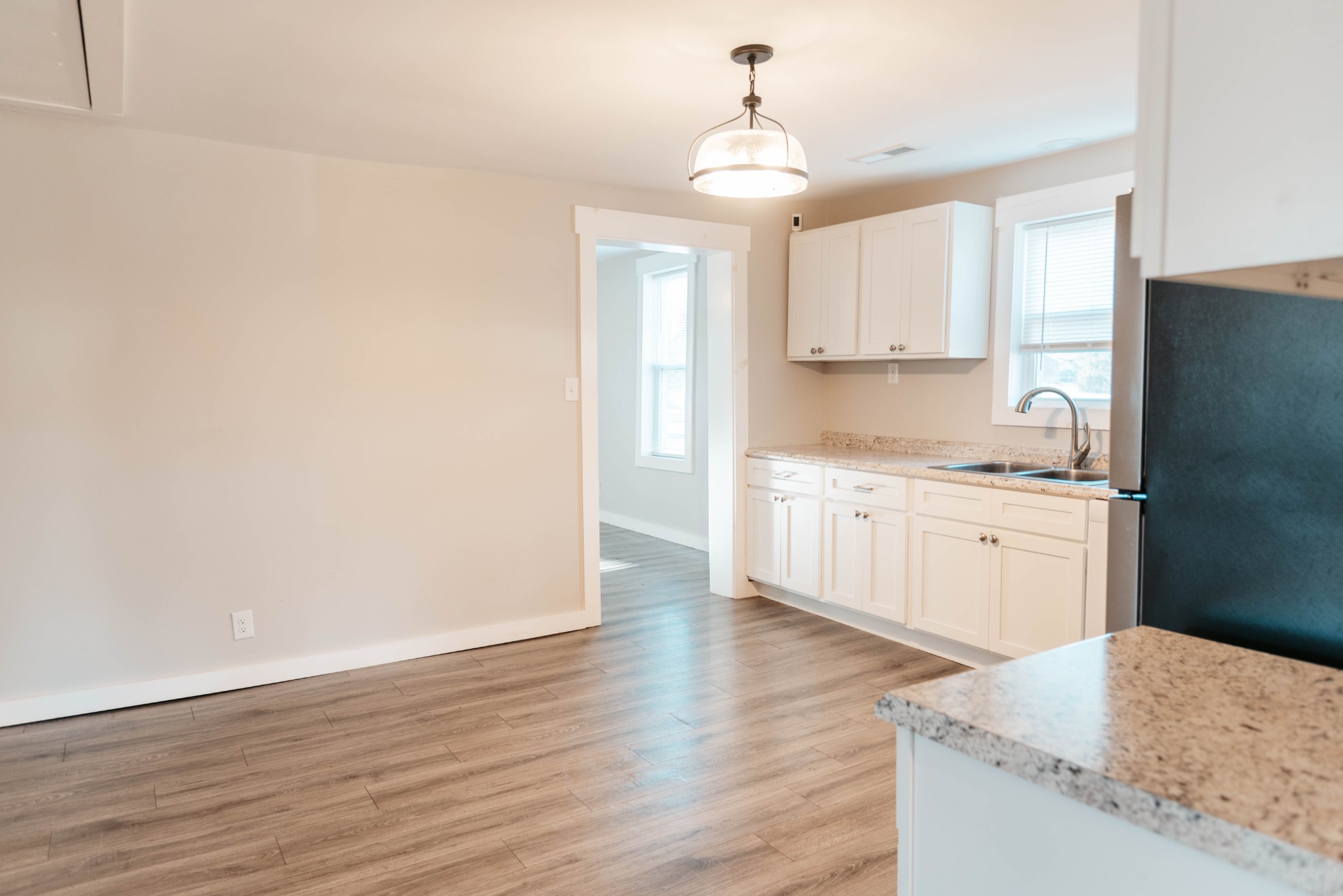 2470 Hinton Road Clarksville, TN 37043 - Photo 11 of 34 a kitchen with a sink a stove cabinets and wooden floor