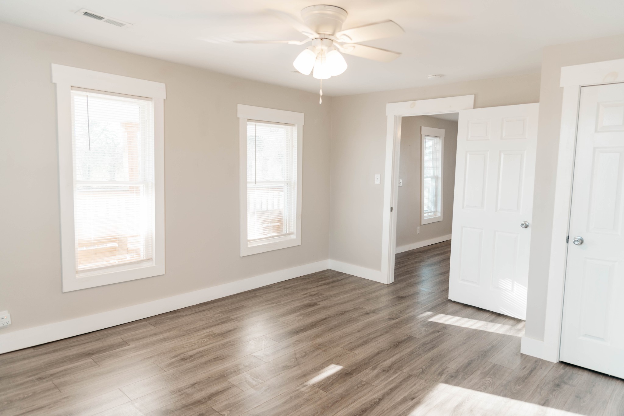 2470 Hinton Road Clarksville, TN 37043 - Photo 12 of 34 a view of an empty room with wooden floor and a window