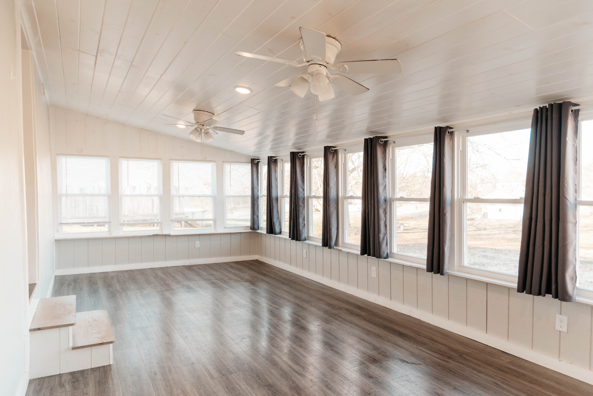 2470 Hinton Road Clarksville, TN 37043 - Photo 21 of 34 a view of an empty room with wooden floor and a window