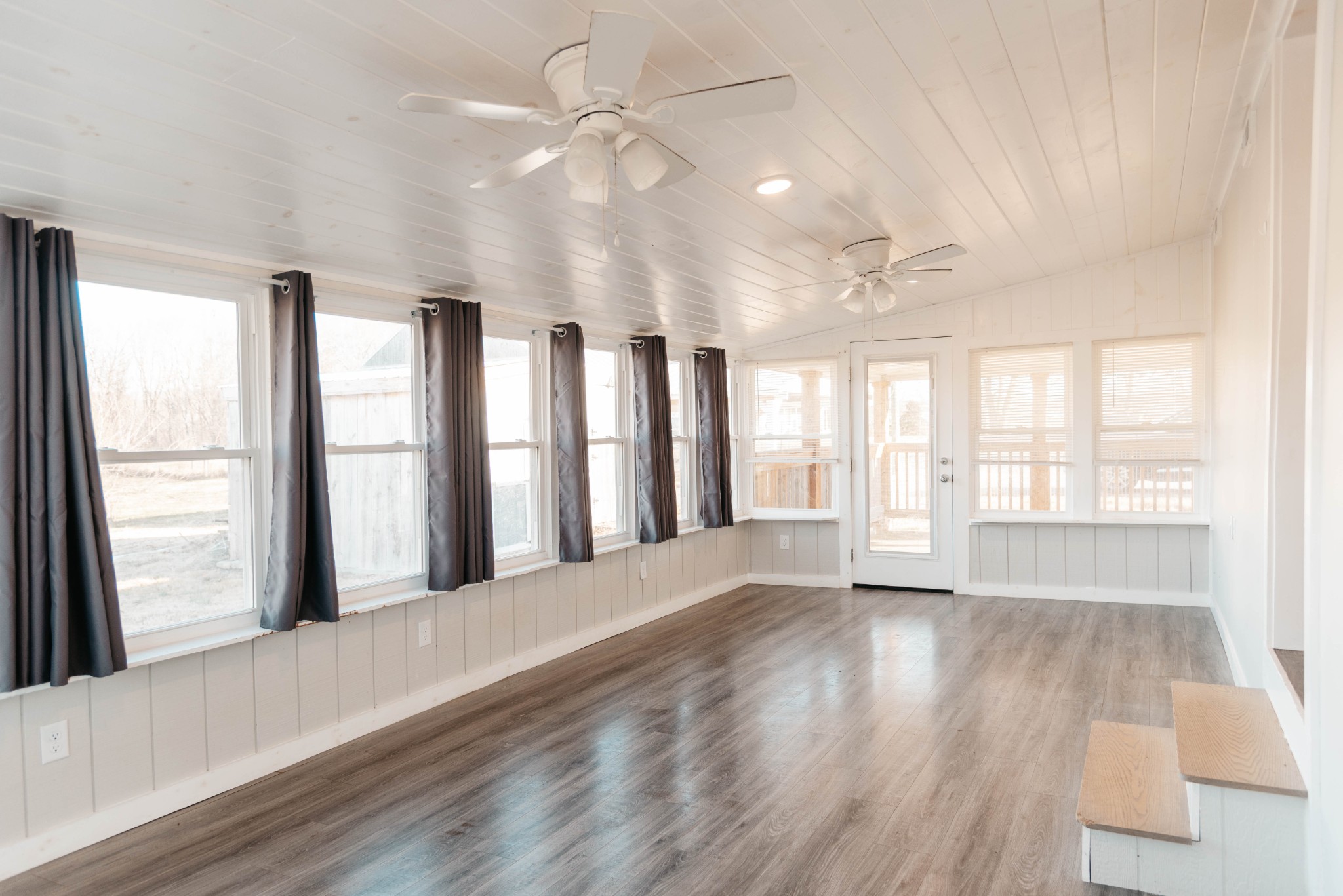 2470 Hinton Road Clarksville, TN 37043 - Photo 22 of 34 a view of an empty room with a window and wooden floor