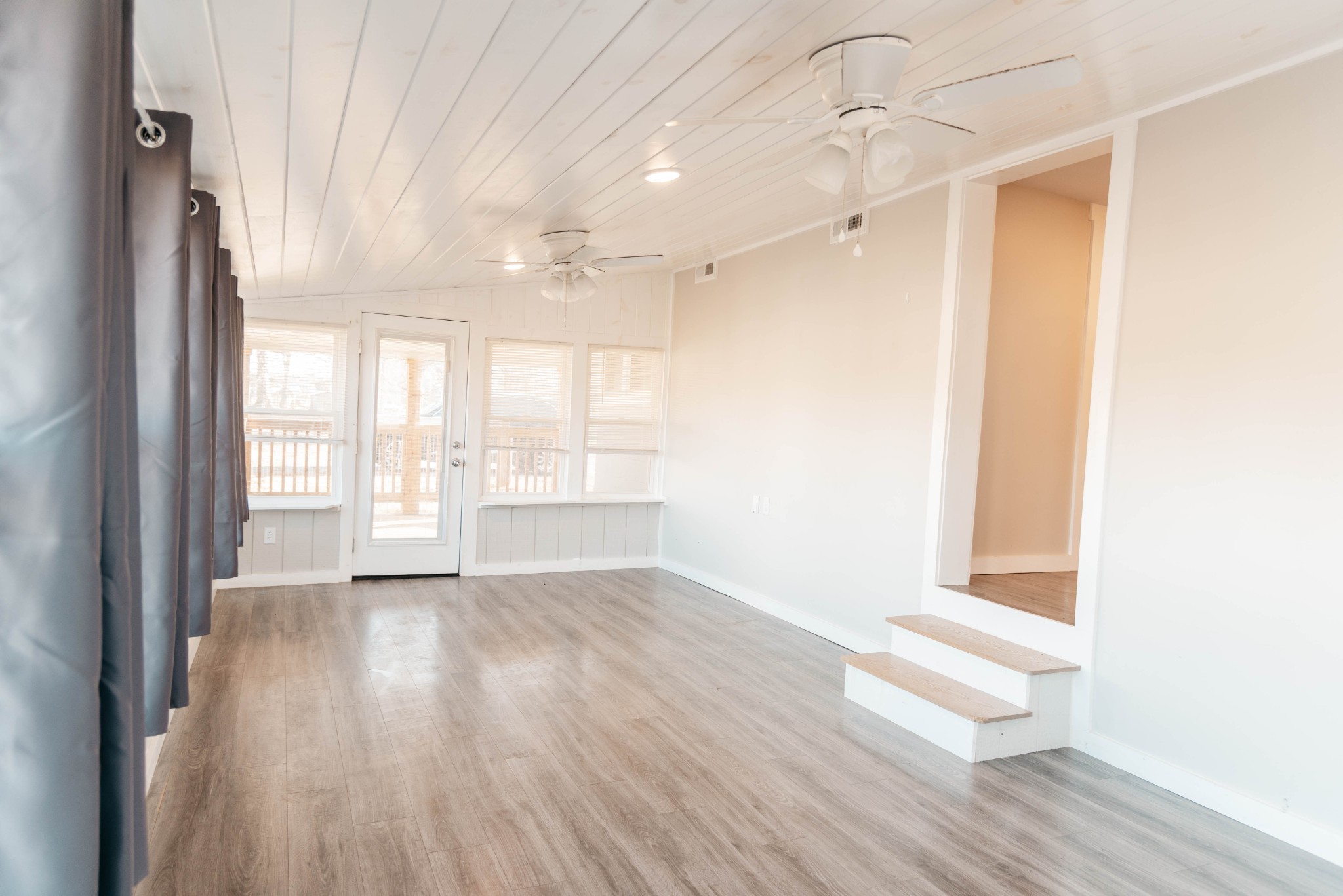 2470 Hinton Road Clarksville, TN 37043 - Photo 23 of 34 a view of an empty room with wooden floor and a window