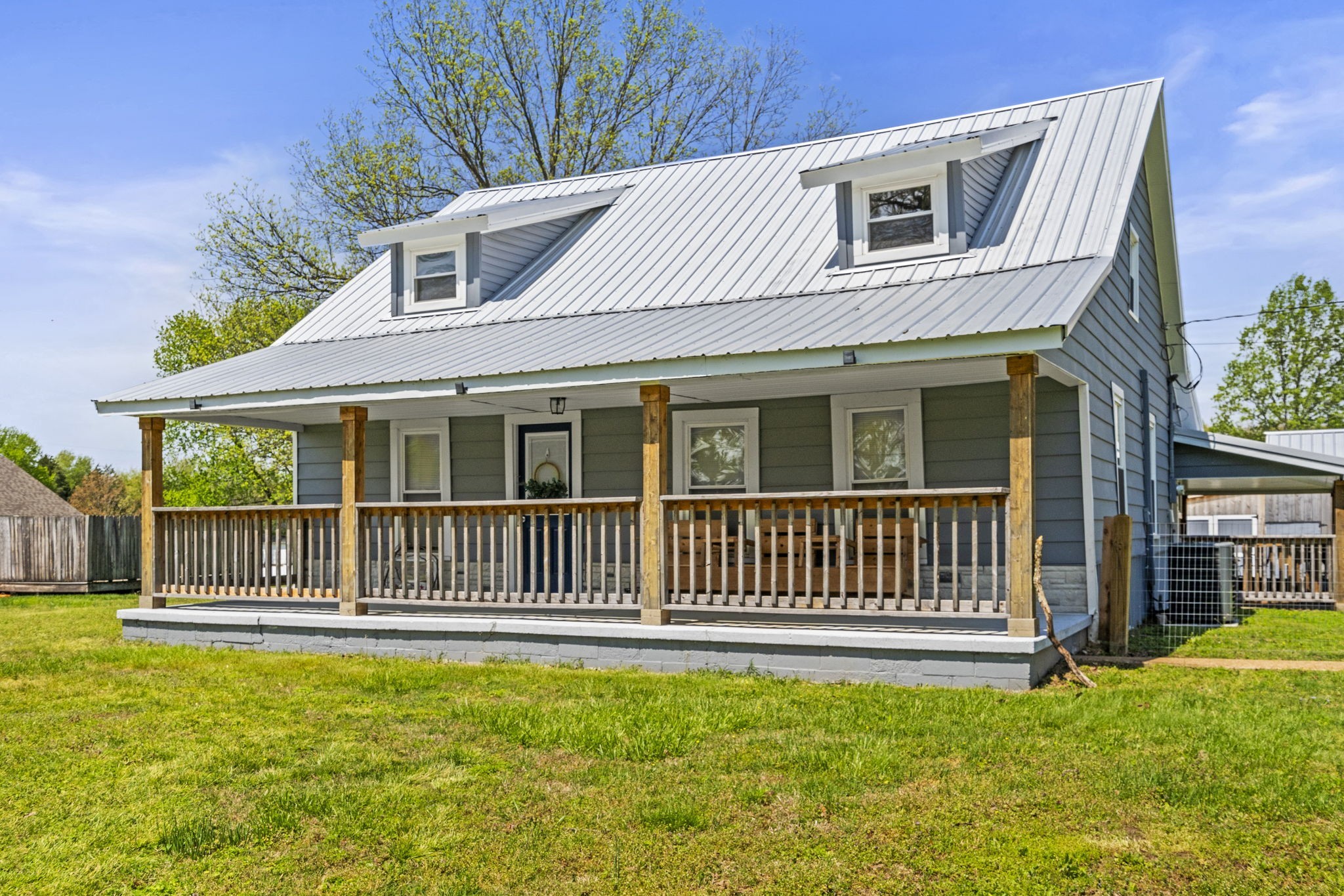 2470 Hinton Road Clarksville, TN 37043 - Photo 3 of 34 a front view of a house with a garden