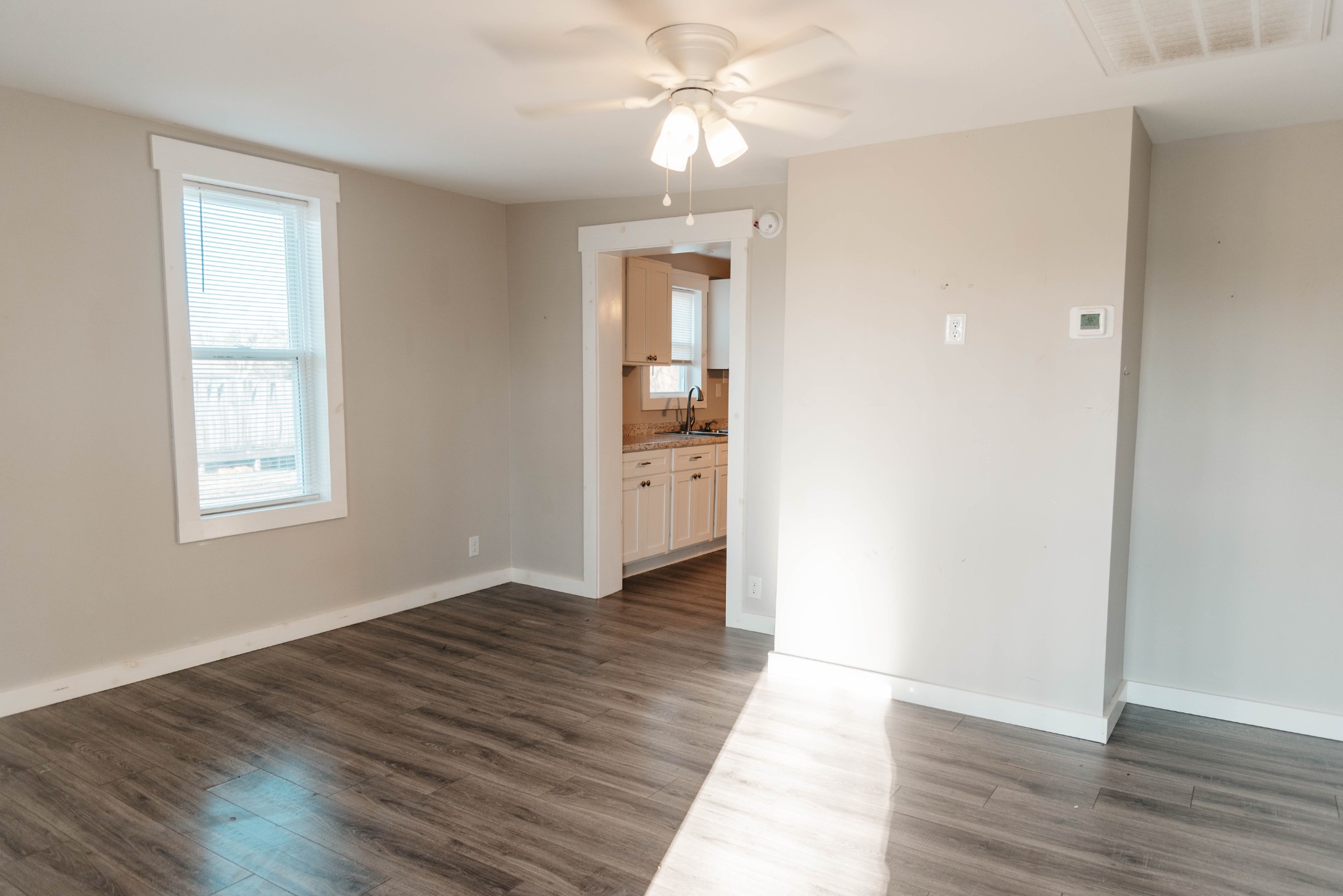 2470 Hinton Road Clarksville, TN 37043 - Photo 5 of 34 wooden floor in an empty room with a window