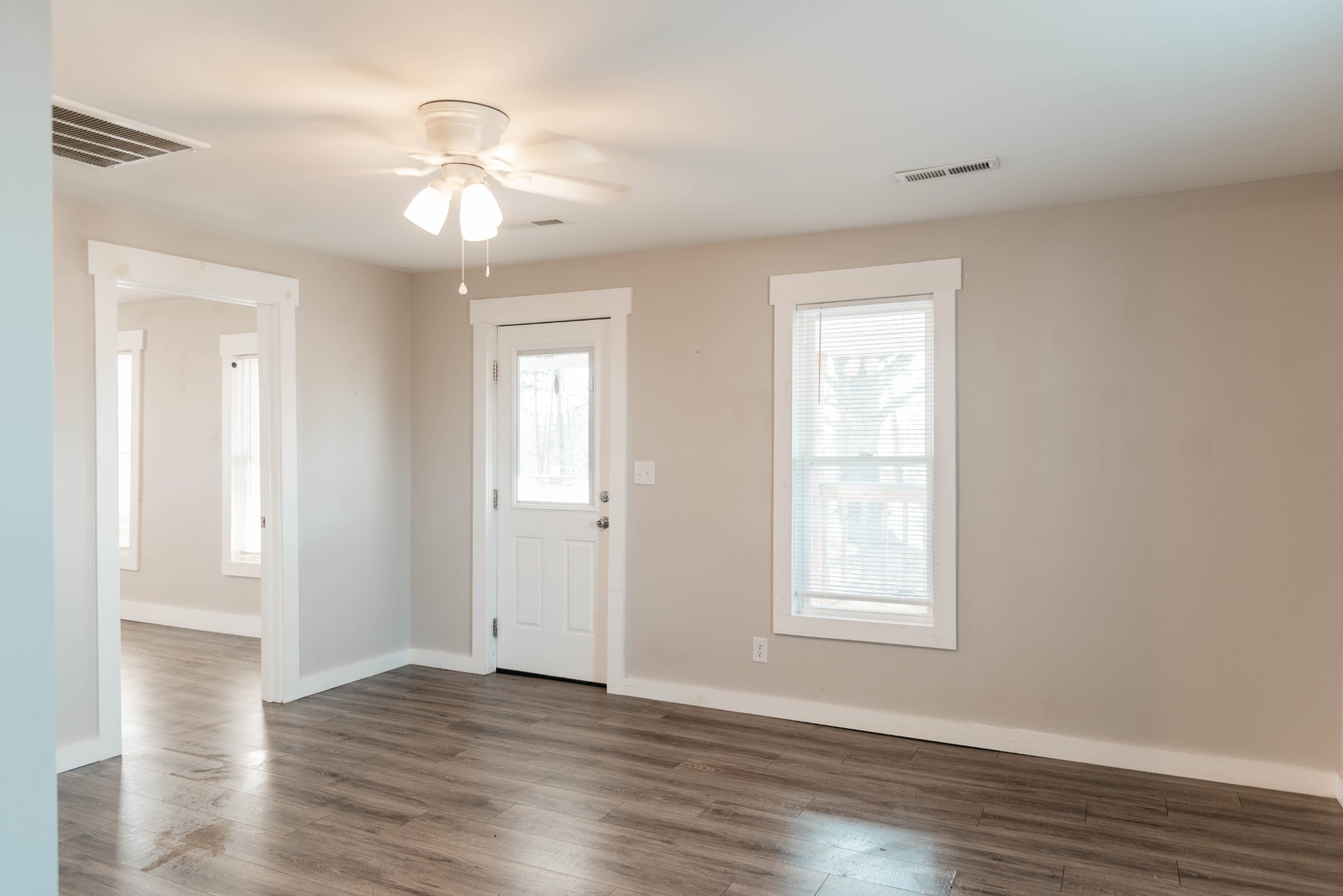 2470 Hinton Road Clarksville, TN 37043 - Photo 6 of 34 a view of an empty room with wooden floor and a window