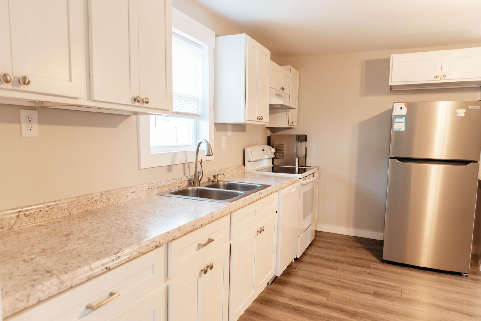 2470 Hinton Road Clarksville, TN 37043 - Photo 7 of 34 a kitchen with granite countertop a refrigerator and a sink