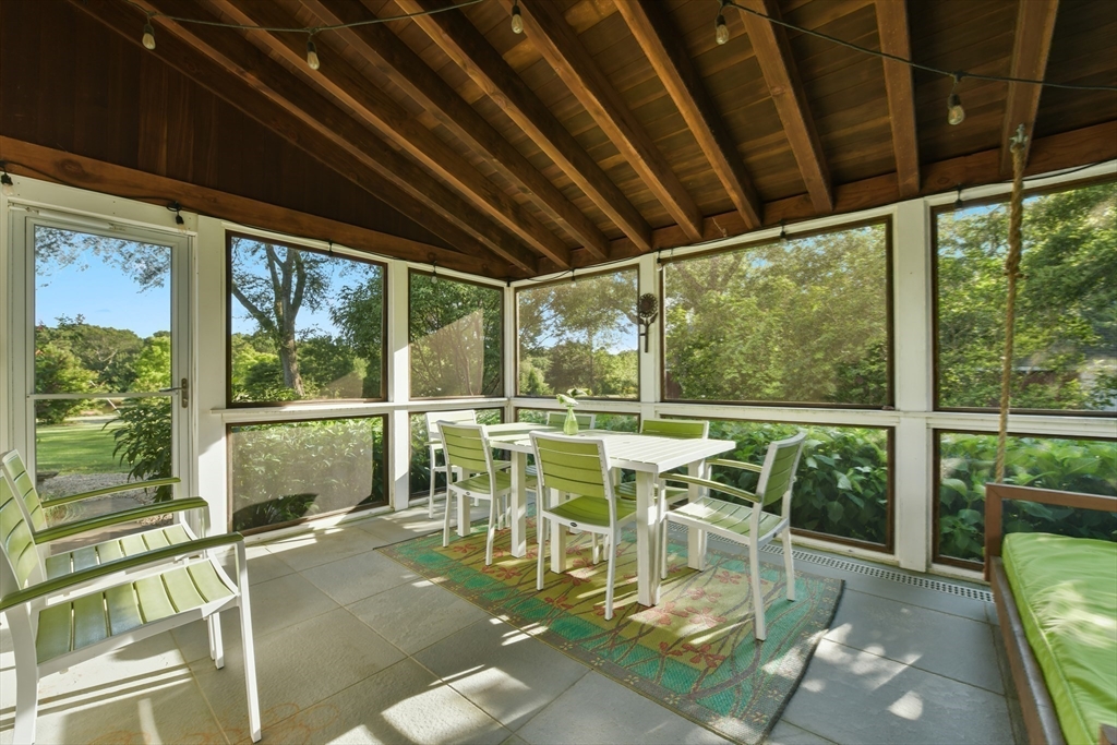 46 Roos Road Sandwich, MA 02537 - Photo 25 of 28 a view of a dining room with furniture window and outside view