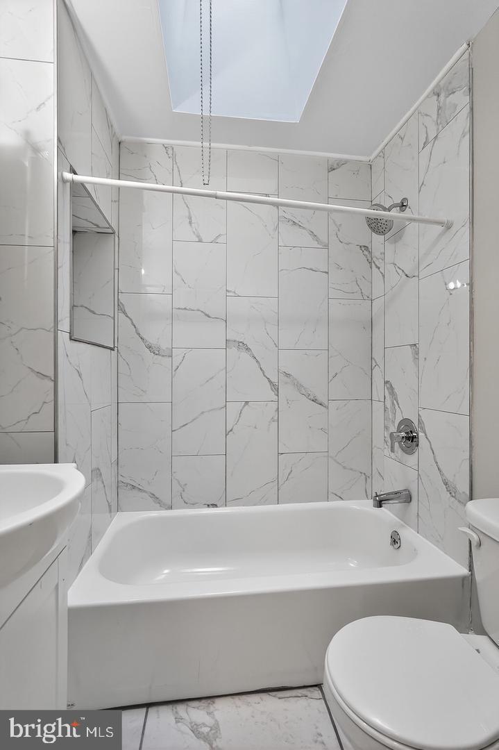 1001 Burnside Road Sharon Hill, PA 19079 - Photo 13 of 21 a bathroom with a toilet and a bathtub