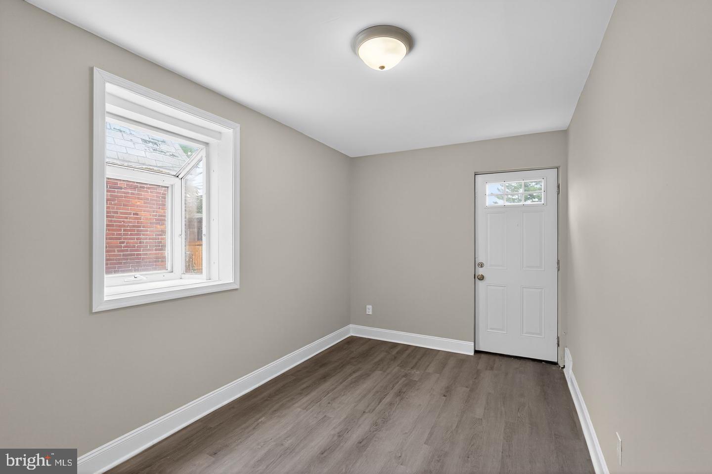 1001 Burnside Road Sharon Hill, PA 19079 - Photo 14 of 21 an empty room with wooden floor and windows