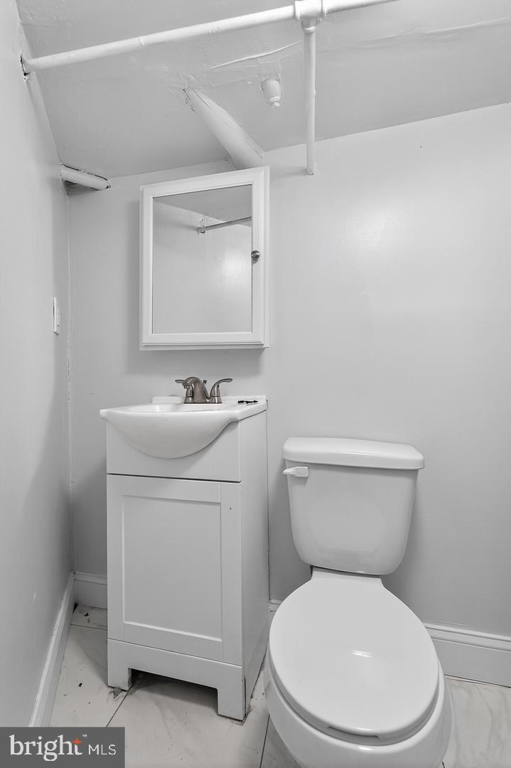 1001 Burnside Road Sharon Hill, PA 19079 - Photo 19 of 21 a white toilet sitting next to a bathroom sink