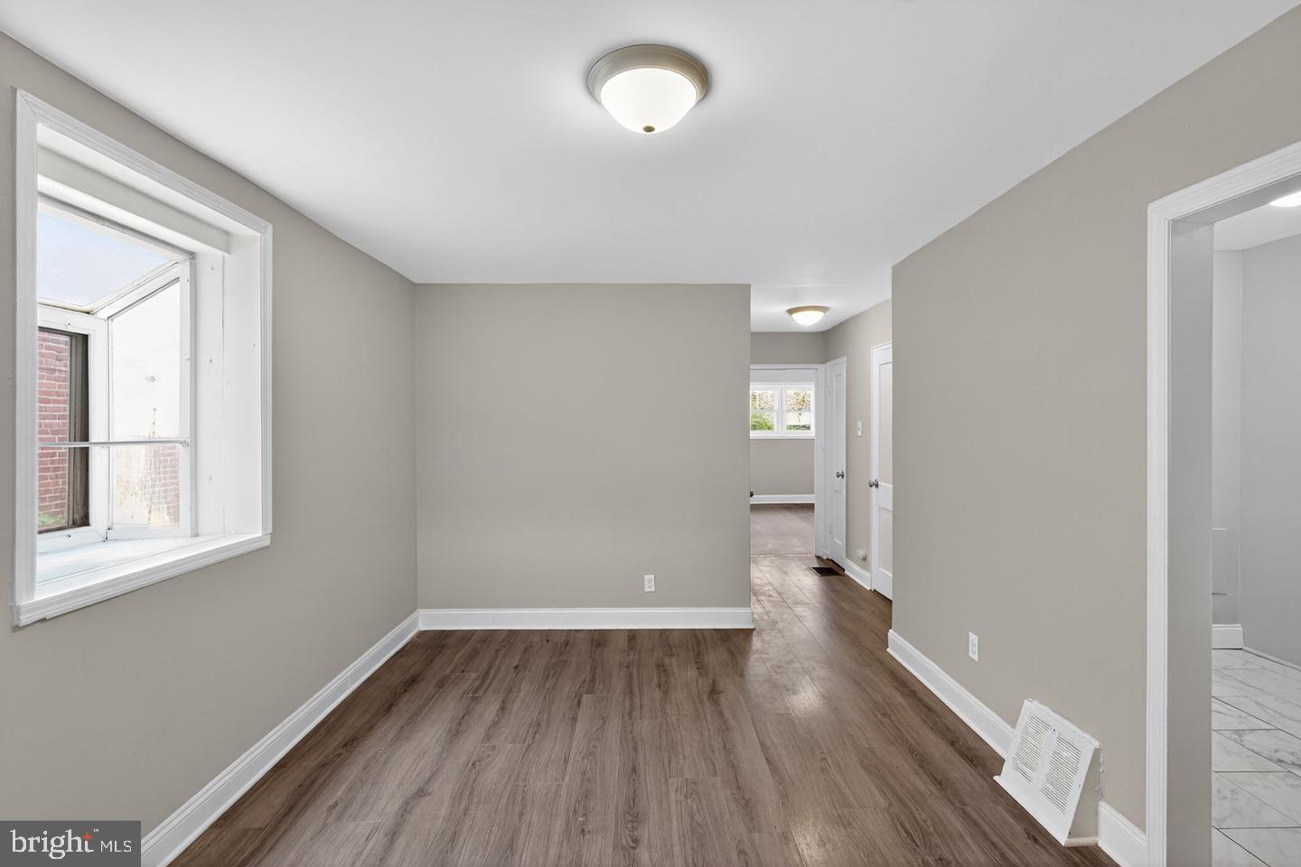 1001 Burnside Road Sharon Hill, PA 19079 - Photo 8 of 21 wooden floor in an empty room with a window
