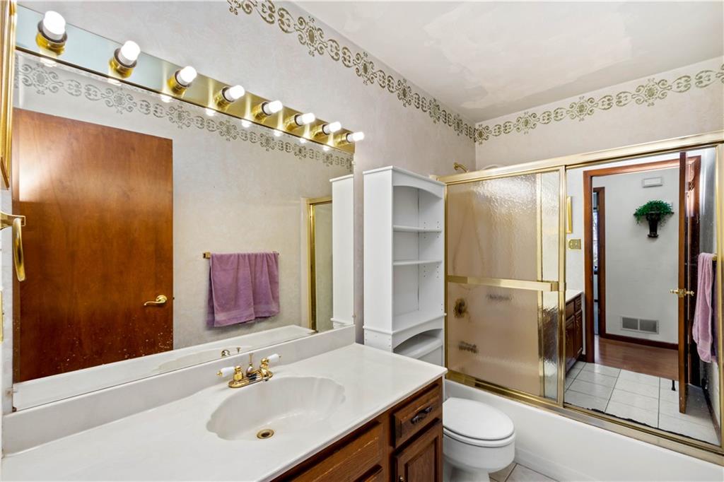 105 Trump Road Cheswick, PA 15024 - Photo 18 of 25 a bathroom with a sink mirror toilet and shower