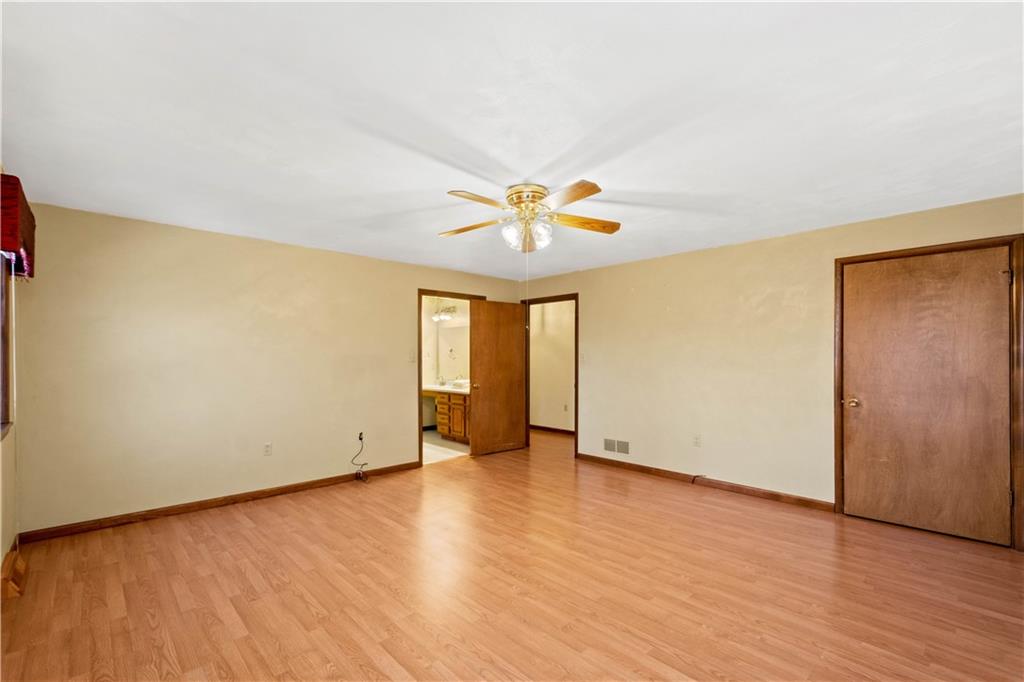 105 Trump Road Cheswick, PA 15024 - Photo 9 of 25 a view of an empty room with wooden floor and a window