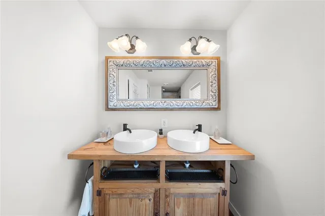 a bathroom with a sink and a mirror