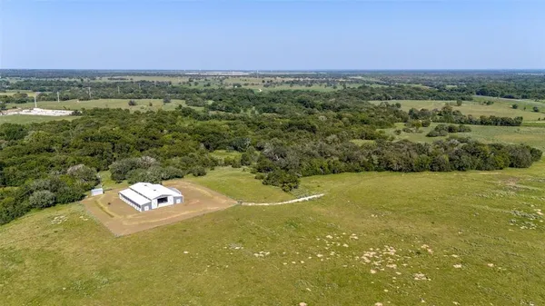 a view of a field with an ocean